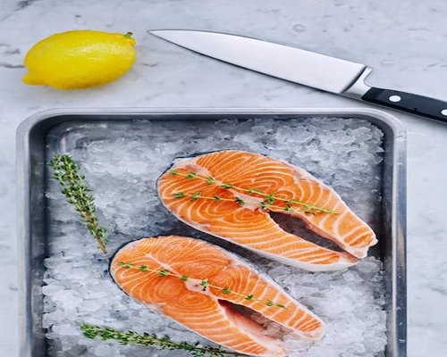 Fresh salmon fillet with lemon and herbs